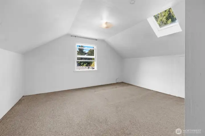 Upstairs showcases two bedrooms and a reading nook area.
