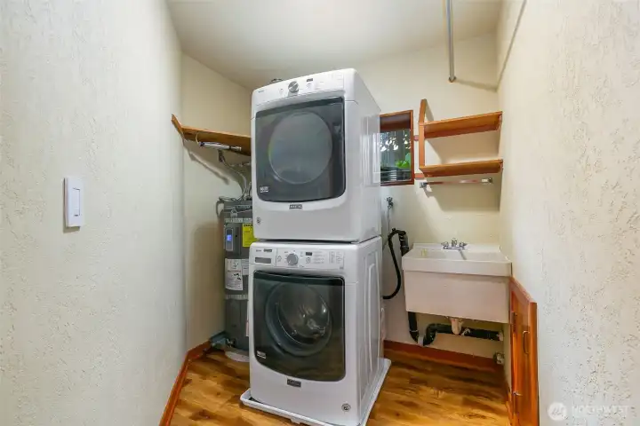 Large laundry room by bedrooms.
