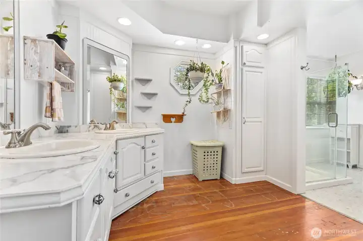 Huge main floor bathroom right next to owner's suite. Tons of cabinets, original floors