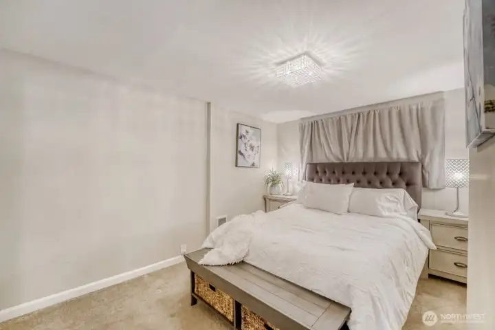 The primary bedroom offers quiet sanctuary for even teh lightest sleeper.