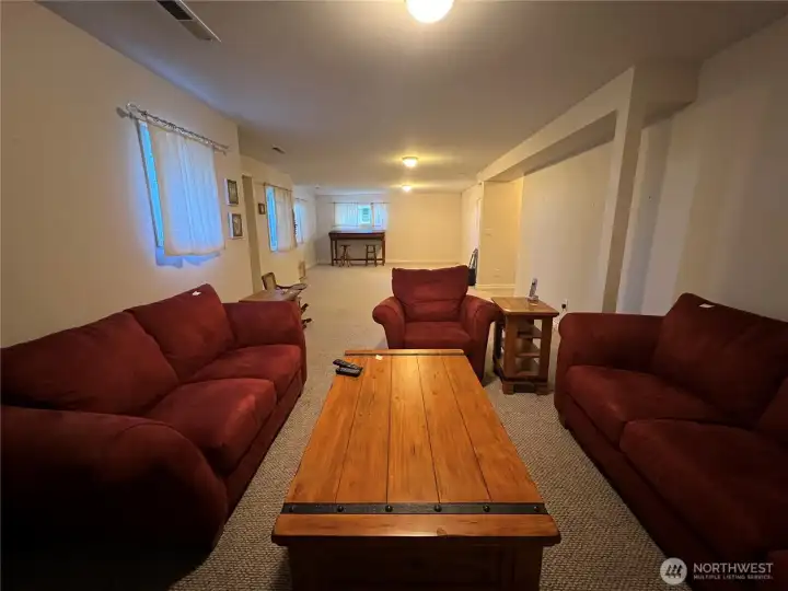 Basement family room w/ exterior walk out to beach side