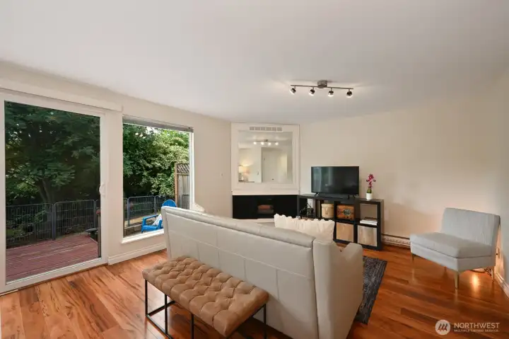 Living room looks out to the green belt in the backyard.