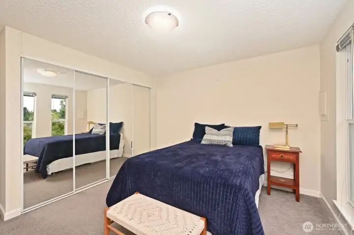 Bedroom #2 with built-in closet organizer.