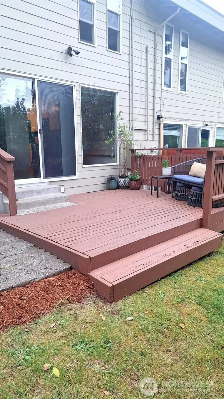 Freshly painted deck and newly laid out pavers.