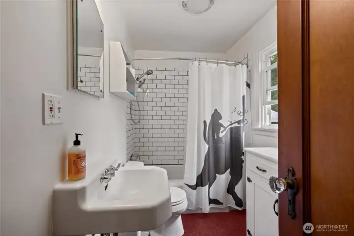 Main floor bathroom with subway tile finishes
