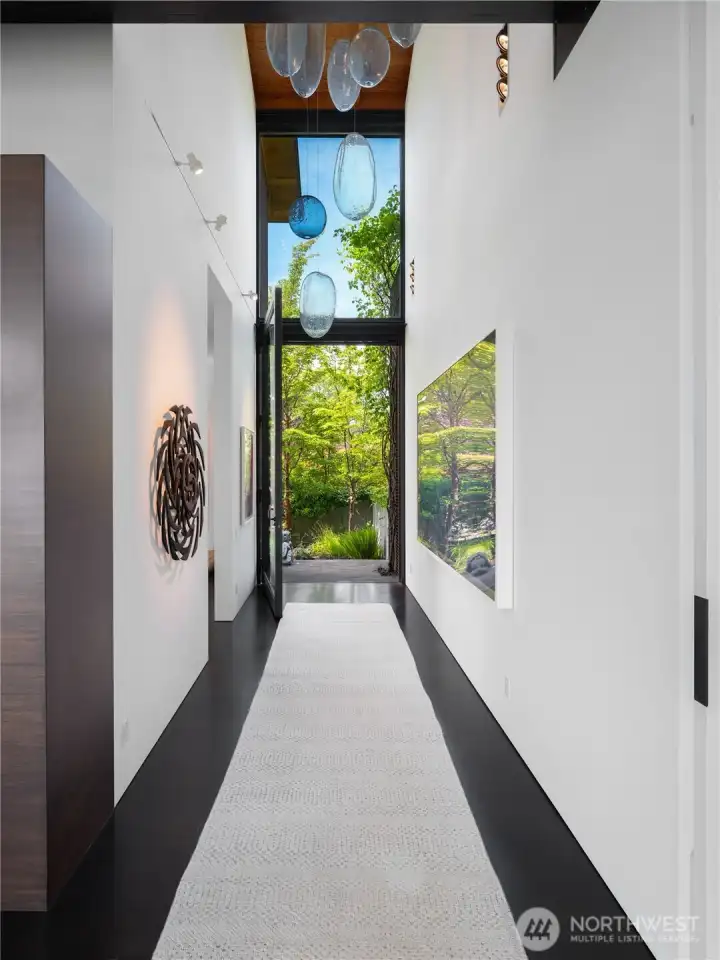 Main hallway offers high ceilings and large walls, an ideal backdrop for large scale art.