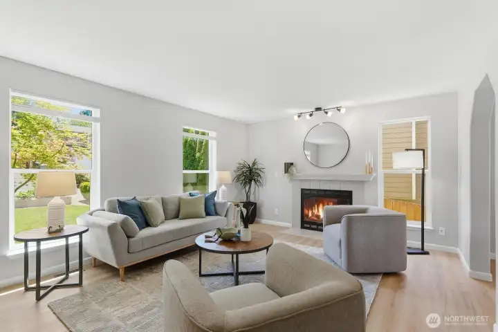 Fresh interior paint and new LVP floors glow in fantastic light pouring in through new windows.