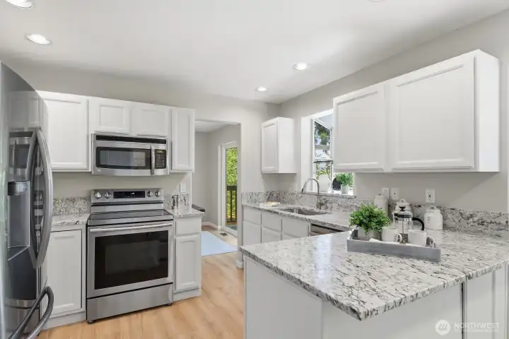 Stylish updates and stainless steel appliances make this kitchen a joy to cook in!