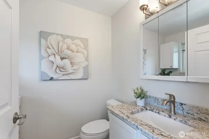 Handy half bath/laundry room combo just off of the kitchen.