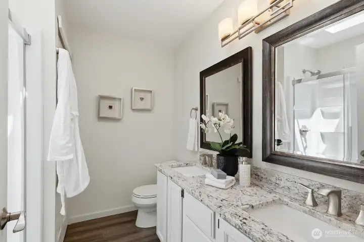 Stylish primary ensuite bath.