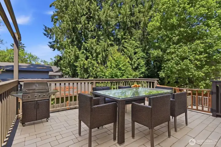 Head outside to discover your backyard oasis, complete with this sun-drenched two-tier deck!