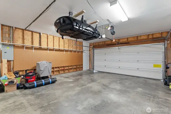 Oversized 2-car garage offers space for parking, storage and projects.