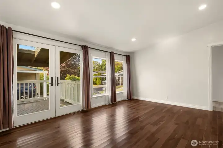 Family Room with French Doors Open to Expansive Deck