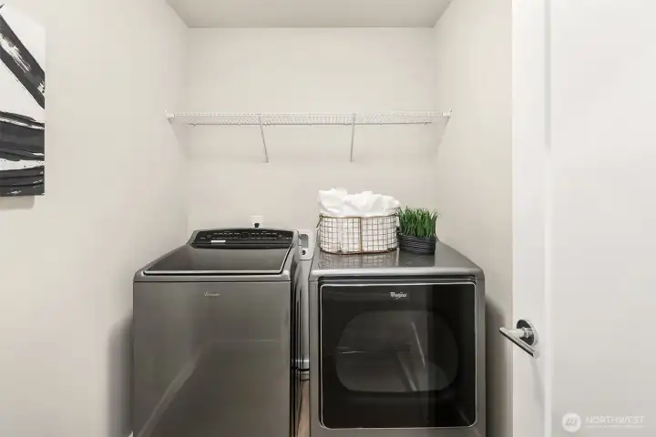 Upper level laundry room - full size machines with room for storage!