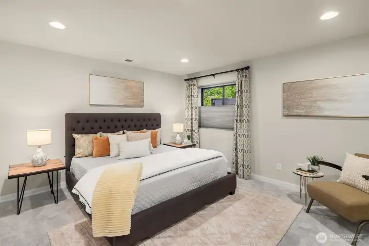 There's a huge private guest suite on the lower level. Owner added a full custom closet system and upgraded the attached three quarter bath