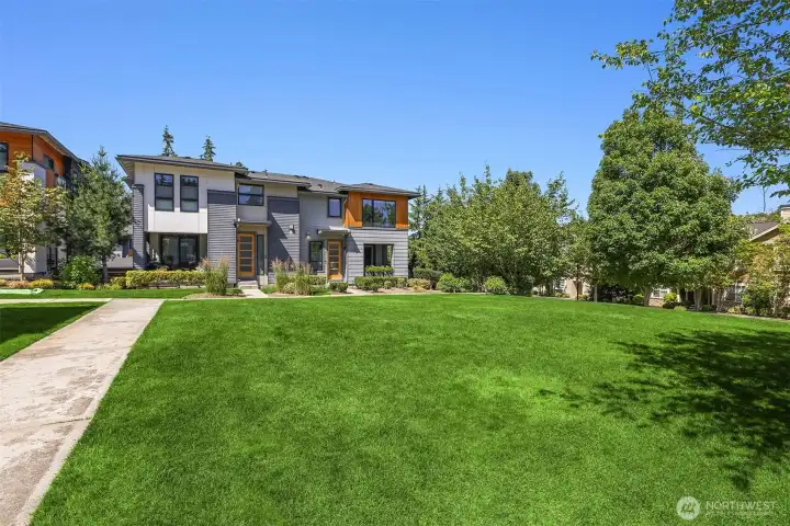The home overlooks the community green space. There's also guest parking spots within the community