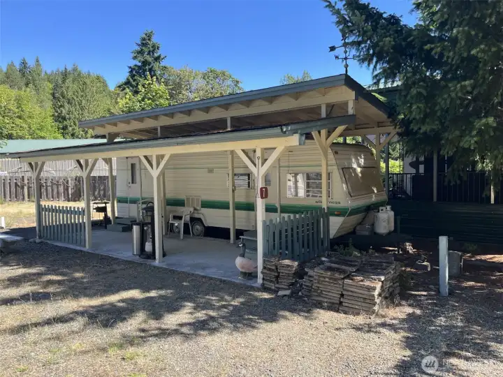 Lot #7 is a 27-ft Wilderness trailer. Very neat and clean, also with covered patio. Lot #7 is a 27-ft Wilderness trailer. Very neat and clean, also with covered patio.