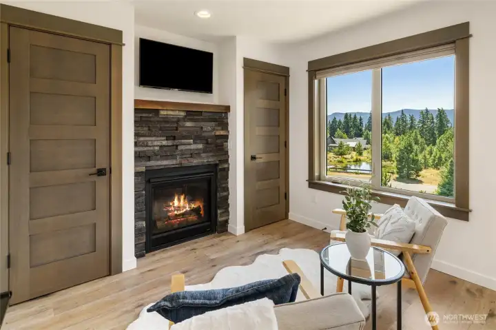 Primary bedroom sitting area with natural gas insert.