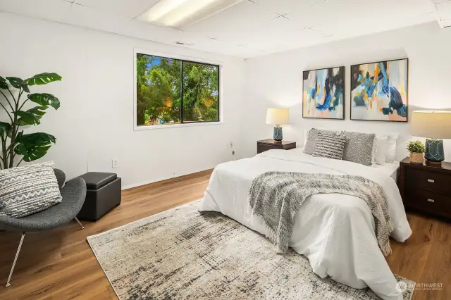 The lower level bedroom with view to the back yard.