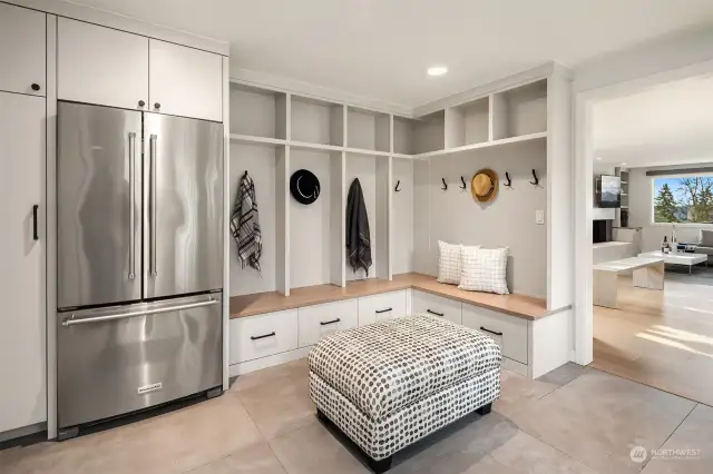 A mudroom space like none other. Lots of storage, cubbies and even drawers to pack away those important incidentals. The heated floors come in handy when coming in from out in the cold. Back up fridge and freezer right off the kitchen really is perfect for large households.