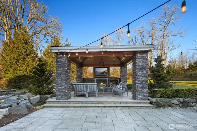The Breathtaking $400,000 Recent Heated Outdoor Living Space Addition Is An Entertainer’s Dream Featuring A Wood-Burning Fireplace, 2 Heaters & TV.