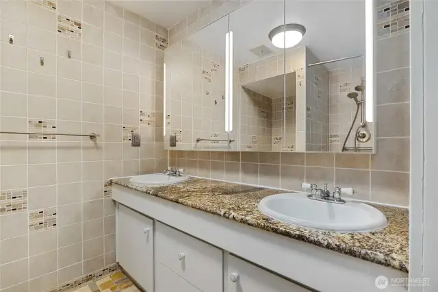 Lower level 3/4 bath with designer tile throughout