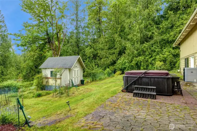Separate tool shed with water or convert into a chicken coop. Hot tub remains!