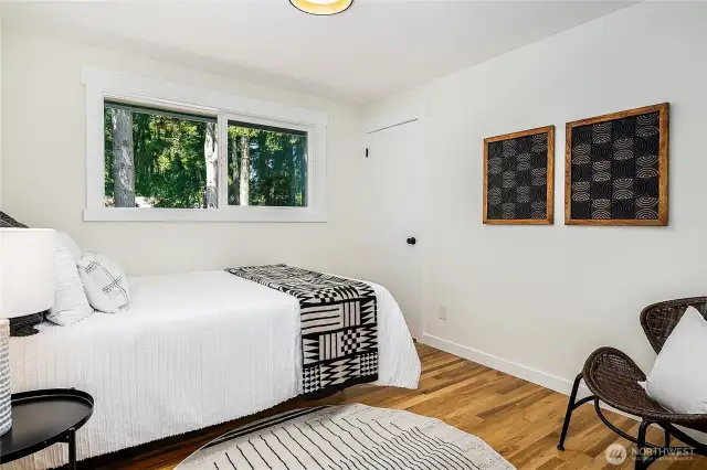 Main level 2nd bedroom. window faces the backyard.