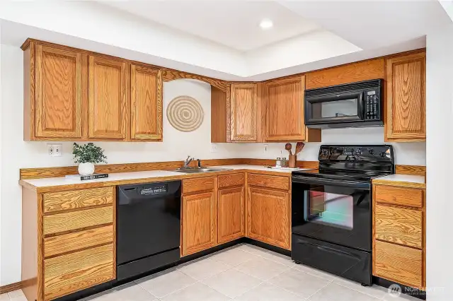 Spacious full-size second kitchen with abundant storage. A convenient pantry is located just to the right, just outside the frame.