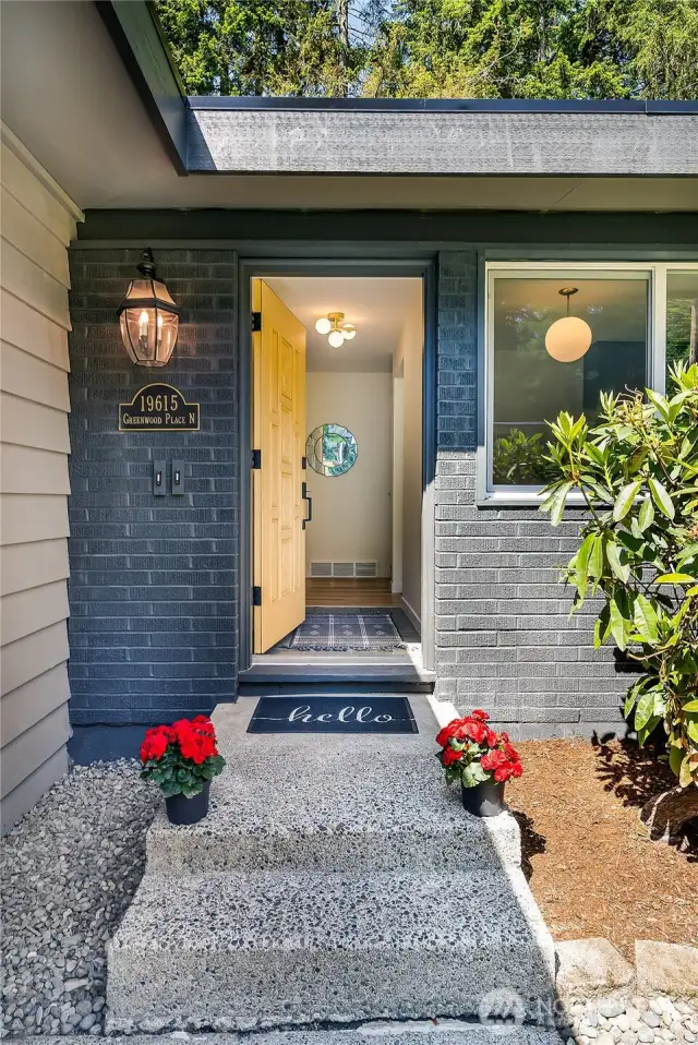 The welcoming front walkway and cheerful entry set the tone—come on in!