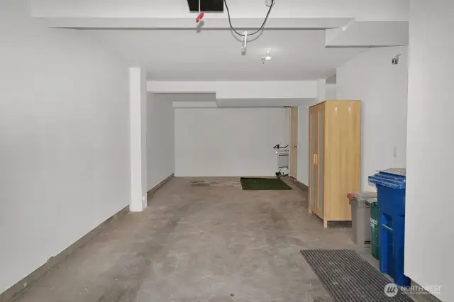 spacious garage with storage area, charging station