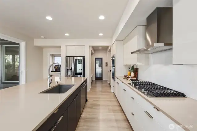 An entertainers or chef's dream kitchen with so much extra storage, a butler pantry, built in mud room and a walk in oversized pantry.