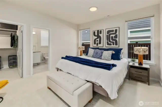 Main floor primary suite, perfect for guests or multigenerational living built in designer closets with LED lights