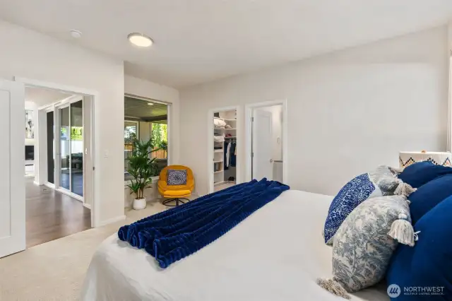Main floor primary suite, perfect for guests or multigenerational living built in designer closets with LED lights