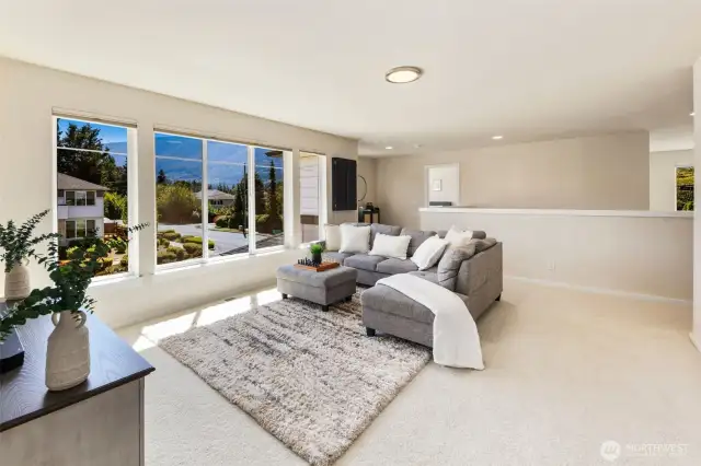 Bonus room with beautiful large windows that bring in natural light and take in the mountain views.
