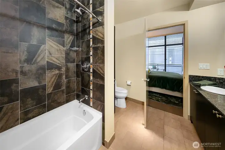 It's lovely to have a dedicated bath in a one bedroom condo (1/2 bath for guests accessed from the living space.