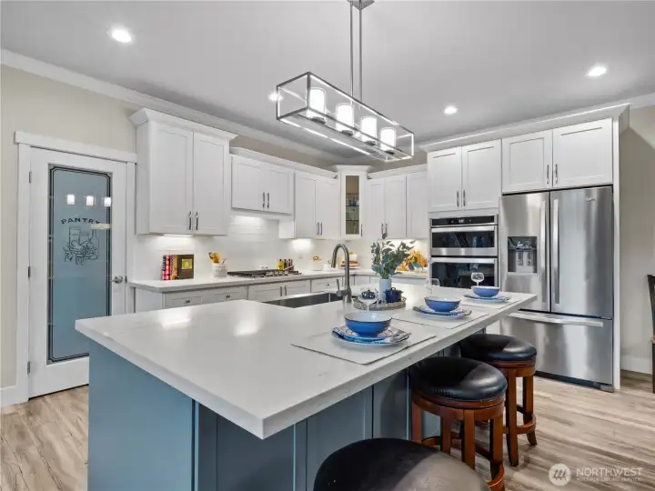 The two-tone kitchen is a chef's dream. Eat, cook, and entertain at the same time.