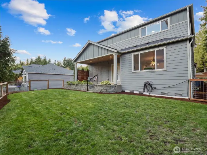 The fully fencedd back yard is great to keep the little ones and your furry friends secure.