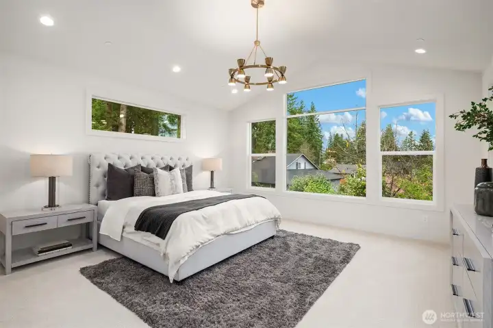 Designer primary suite with five-piece bath with heated floors