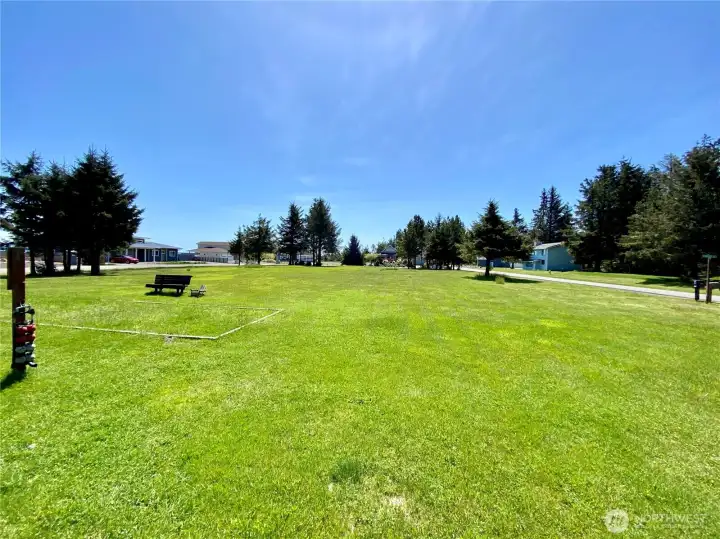 Gunderson park with picnic table, horseshoe pits, and open space.