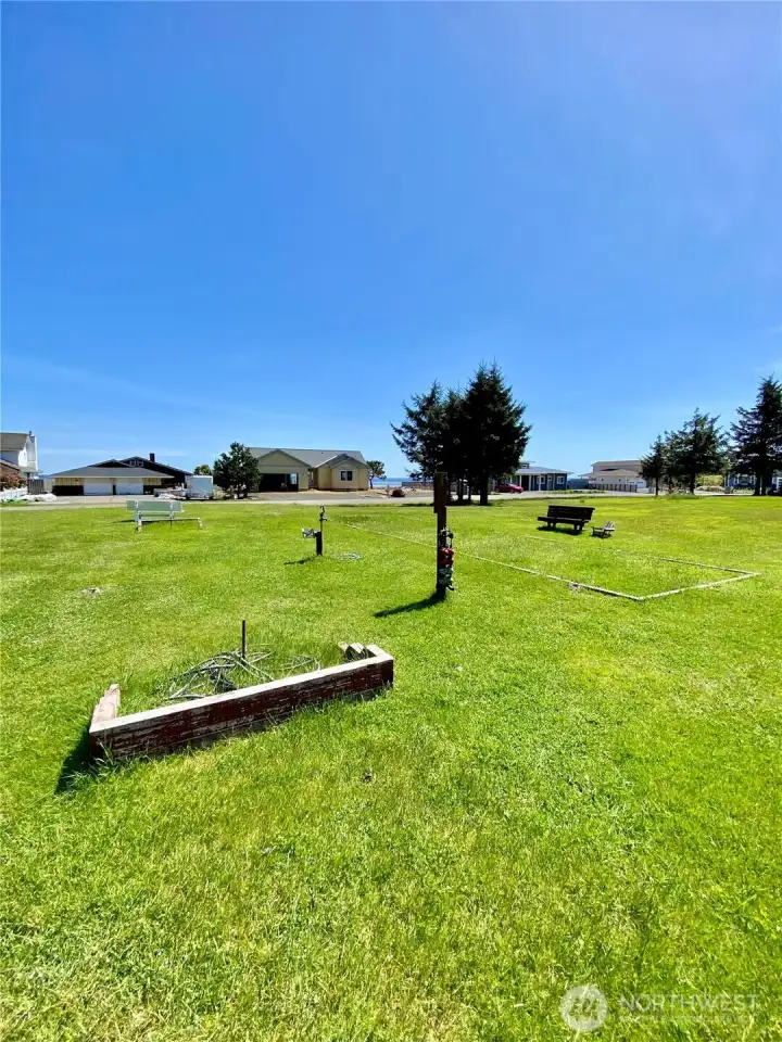 Gunderson park with picnic table, horseshoe pits, and open space.