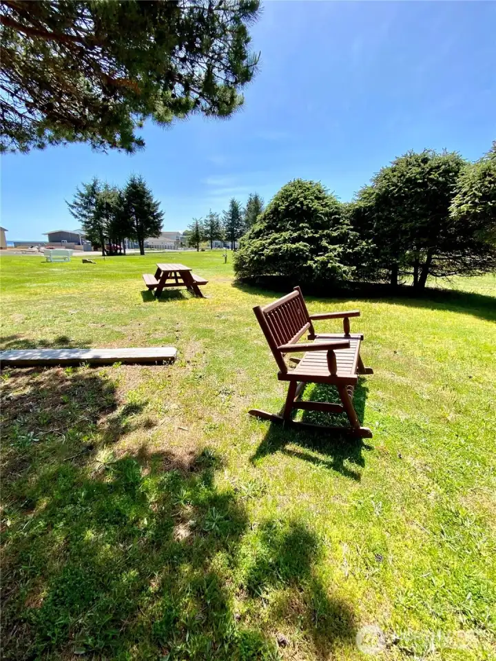 Gunderson park with picnic table, horseshoe pits, and open space.