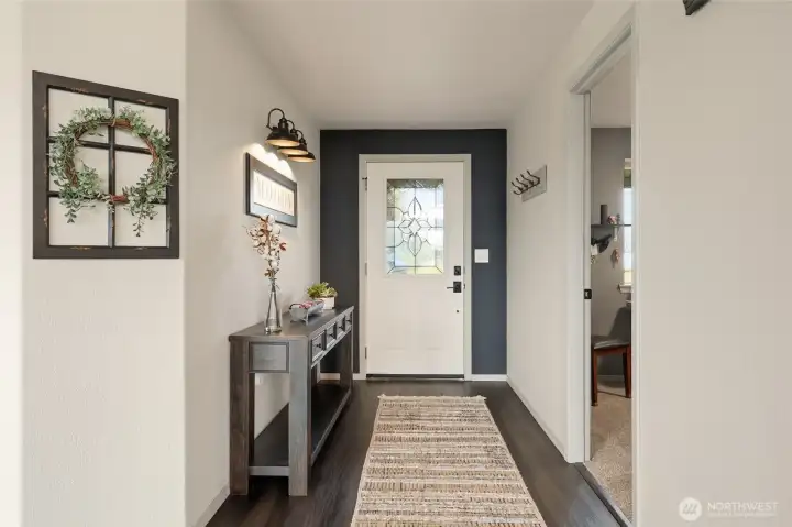 The quality, style, and clean lines in this entry are indicative of what you'll find throughout the home--it's FABULOUS!  First bedroom/office seen on right.