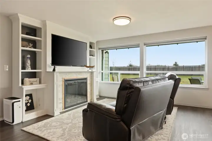 Don't miss the elements of these built-ins, such as crown molding, detailed fireplace trim, and backdrop accent color.