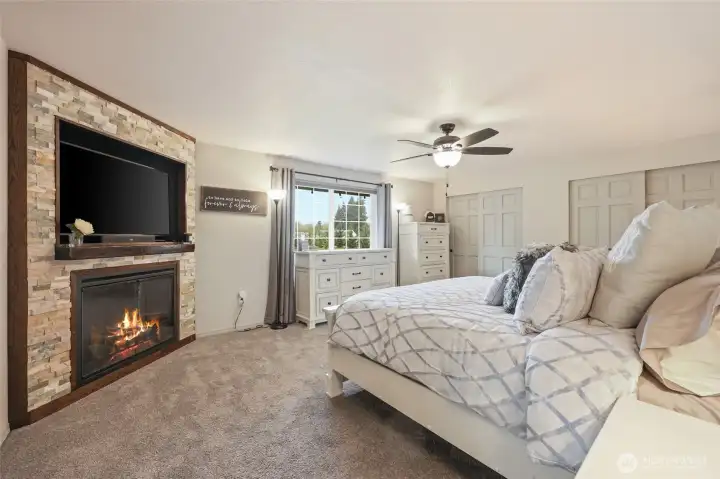 Arguably the most appealing room in the home, the primary en suite is dreamy with this gorgeous stone fireplace!