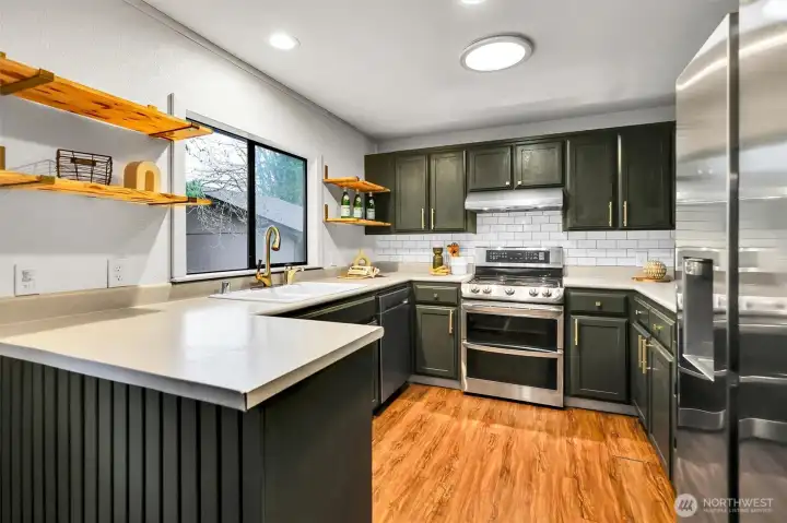 The kitchen offers plenty of room to cook, gather, and stay part of the conversation.