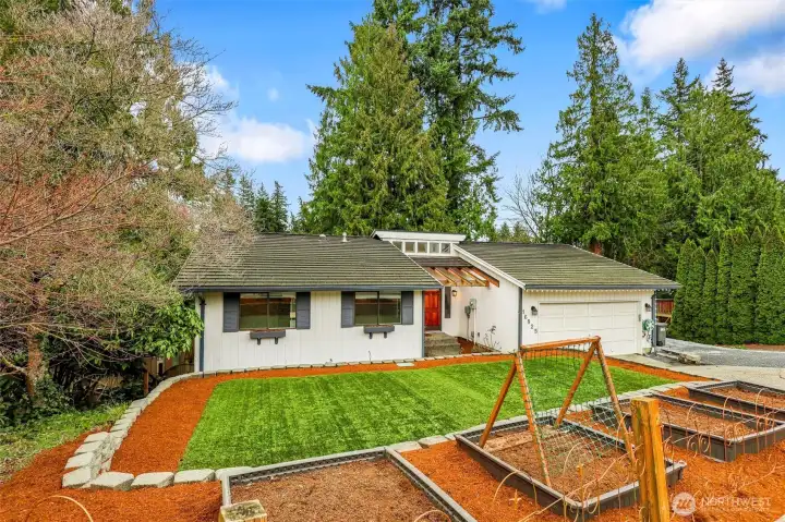A great view of the home’s setting surrounded by greenery.