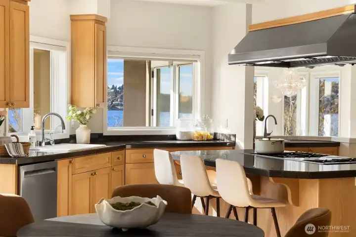 A sun-drenched breakfast nook positioned for morning coffee between the kitchen and the social heart of the home.