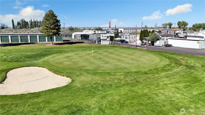 Golf course setting with nearby access to clubhouse, greens, and open space