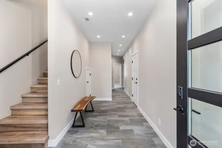 Enhanced with custom tile at the front entry for a refined first impression.